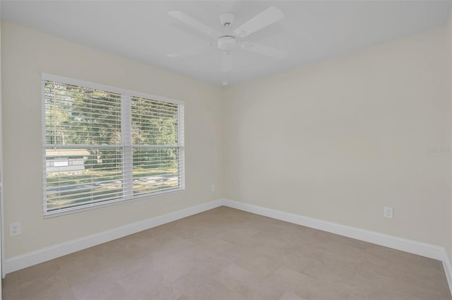 unfurnished room with ceiling fan