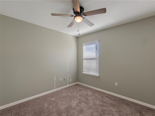 unfurnished room with ceiling fan, carpet flooring, and a textured ceiling