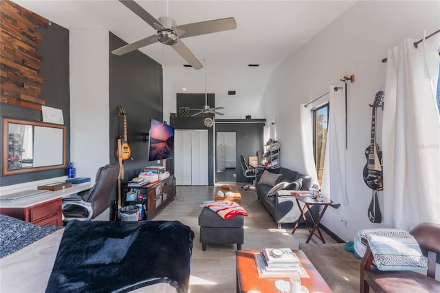 living room with ceiling fan and light hardwood / wood-style floors