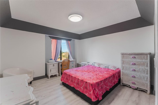 bedroom with wood-type flooring