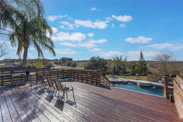 wooden terrace featuring a water view