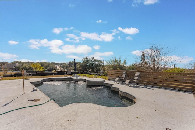 view of swimming pool with a patio