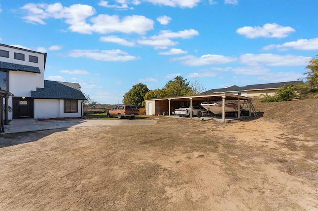 view of yard featuring a carport