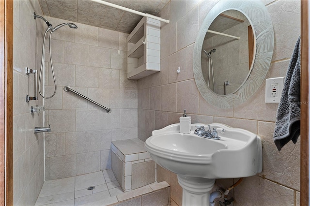 bathroom with tile walls and a tile shower