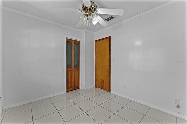 tiled empty room with crown molding and ceiling fan