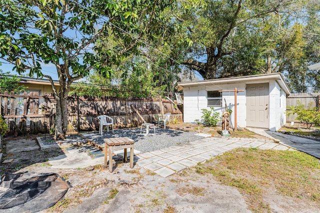 view of patio / terrace with an outbuilding