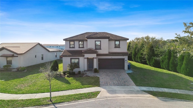 view of front of property featuring a garage and a front lawn