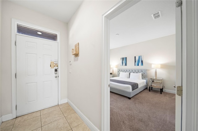 foyer featuring light tile patterned floors