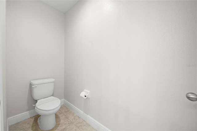 bathroom with tile patterned floors and toilet