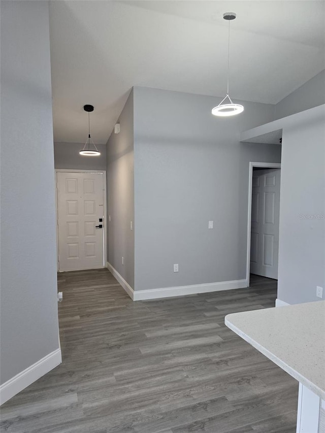 unfurnished dining area featuring hardwood / wood-style flooring