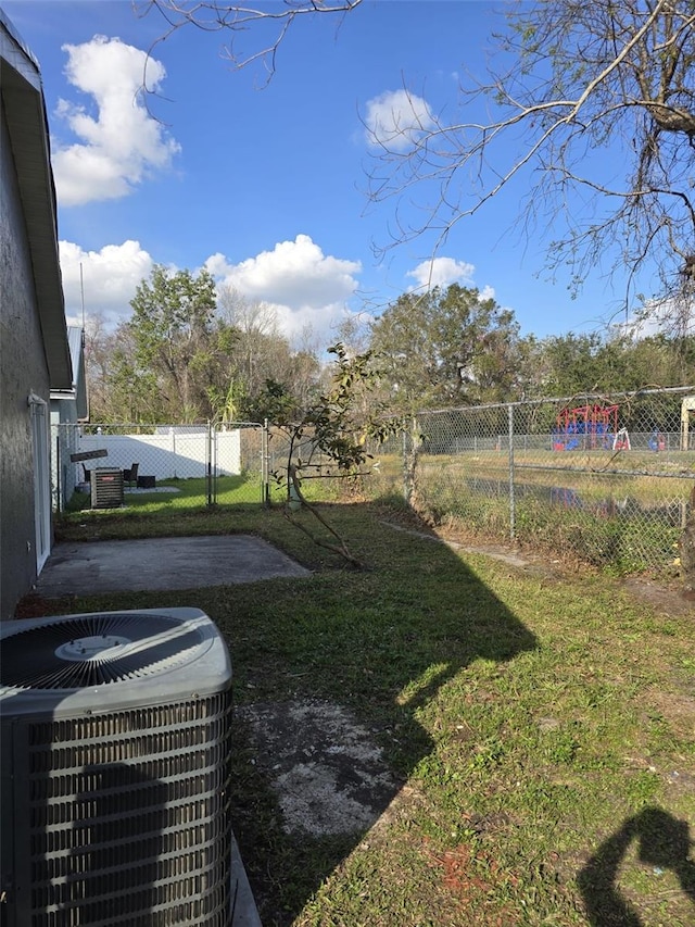 view of yard featuring cooling unit and a patio area