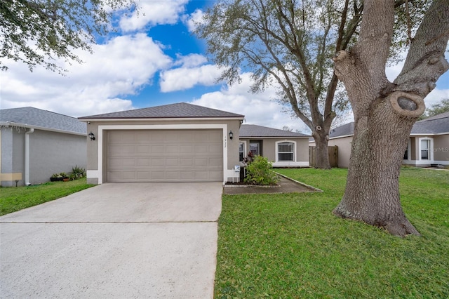 ranch-style home with a garage and a front lawn