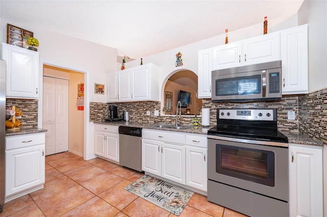 kitchen with stainless steel appliances and white cabinetry