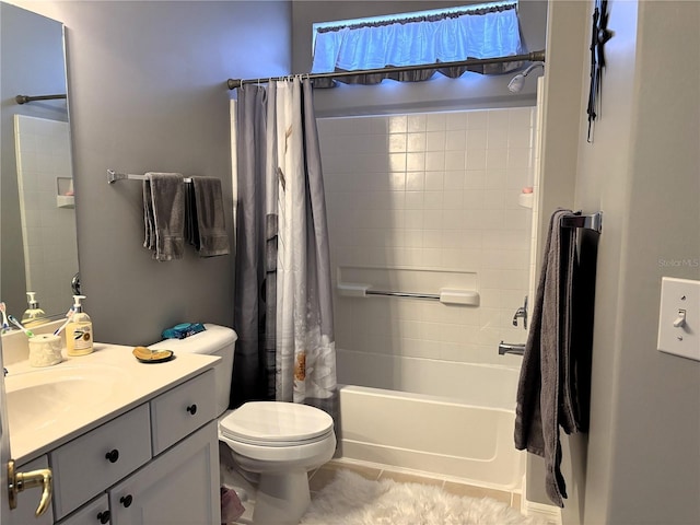 bathroom featuring vanity, tile patterned flooring, shower / bath combo with shower curtain, and toilet