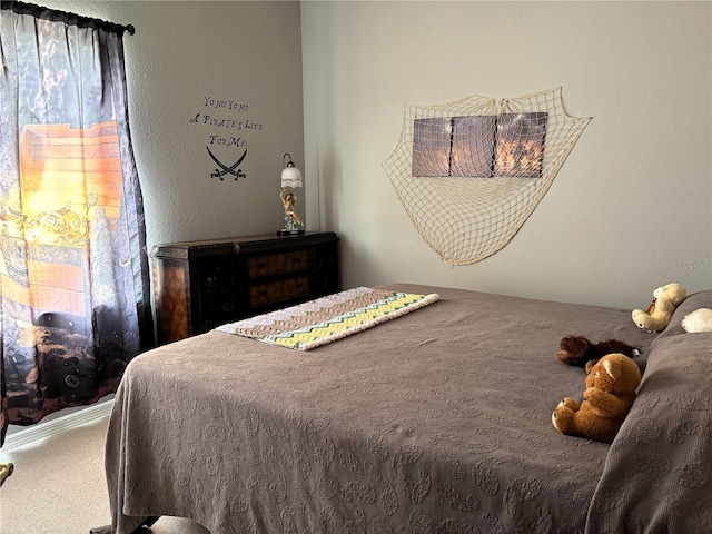 bedroom featuring carpet