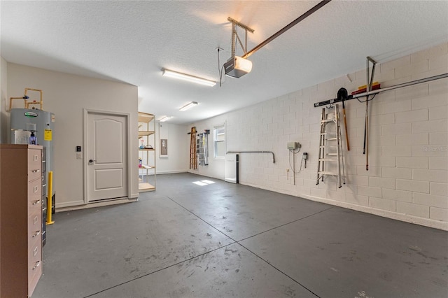 garage featuring electric panel, a garage door opener, concrete block wall, and water heater