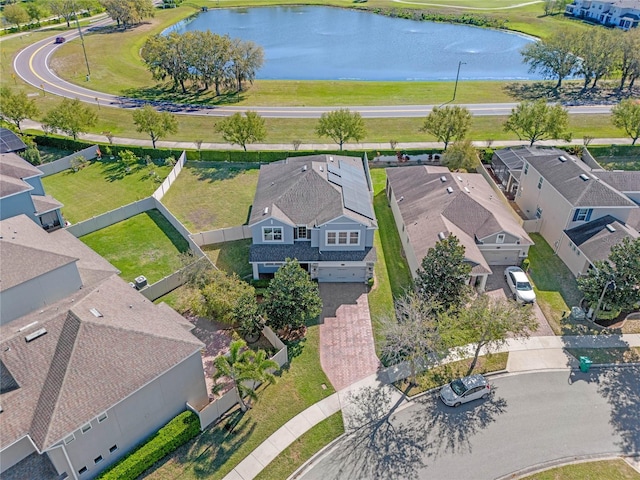 bird's eye view with a water view and a residential view