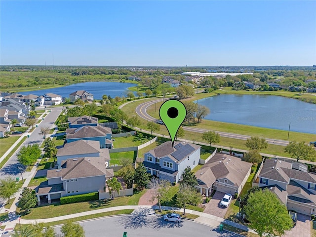 aerial view with a residential view and a water view