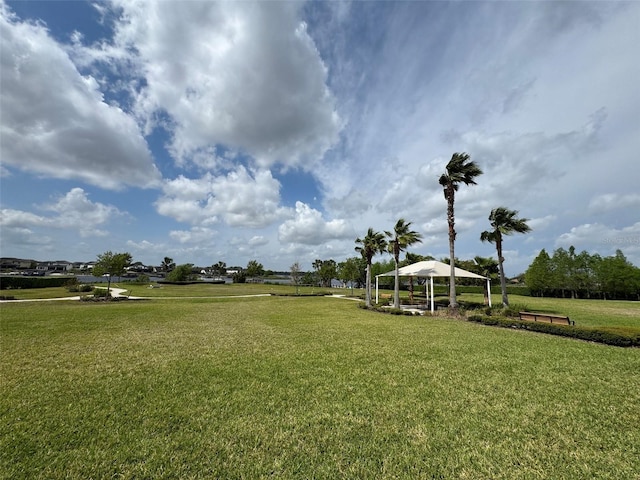 view of property's community with a gazebo and a lawn