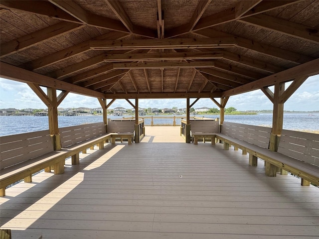 view of dock featuring a gazebo and a water view