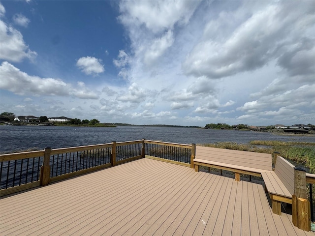 dock area featuring a deck with water view