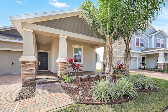 view of front of house featuring a garage and covered porch