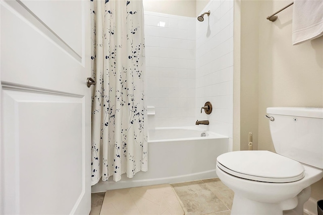 bathroom featuring toilet, tile patterned flooring, and shower / bath combo