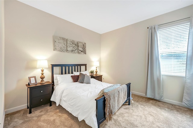 bedroom with light carpet