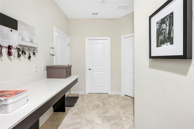 mudroom featuring light tile patterned floors