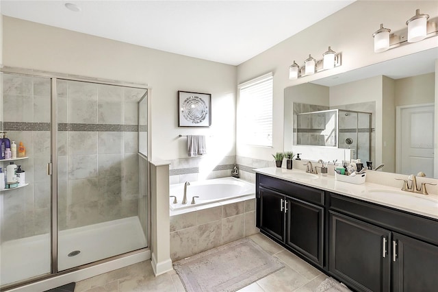 bathroom with plus walk in shower, vanity, and tile patterned floors