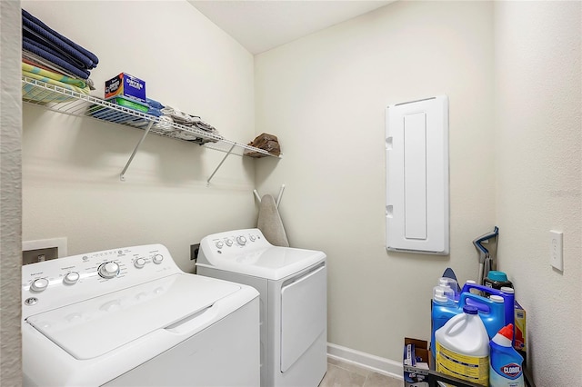 washroom with light tile patterned flooring and washer and clothes dryer