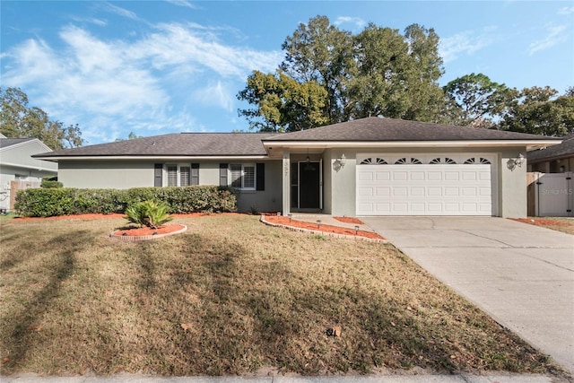 ranch-style home featuring a garage and a front yard