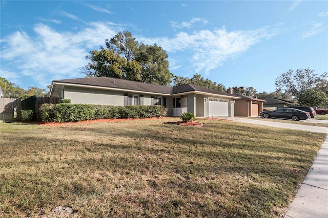 ranch-style house featuring a garage and a front yard