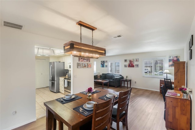 dining area with light wood-type flooring