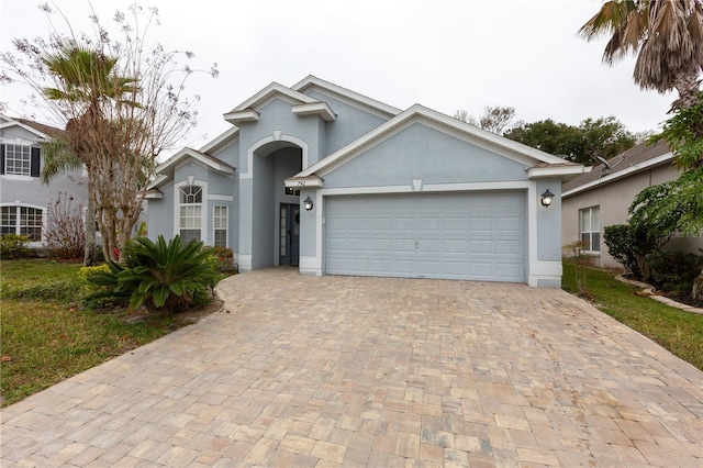 view of front of property with a garage