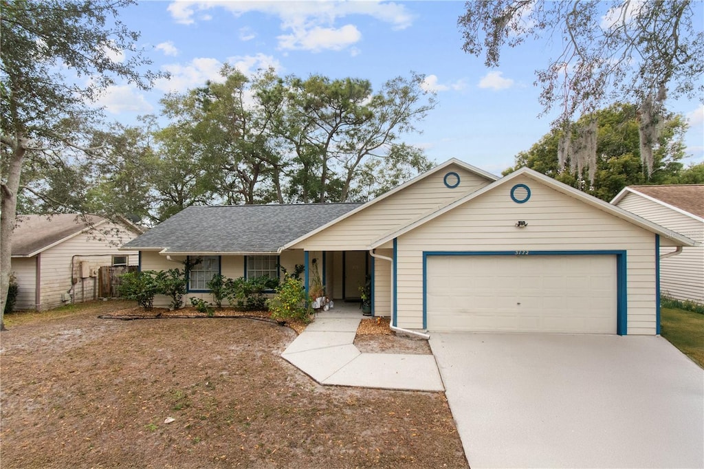 single story home featuring a garage