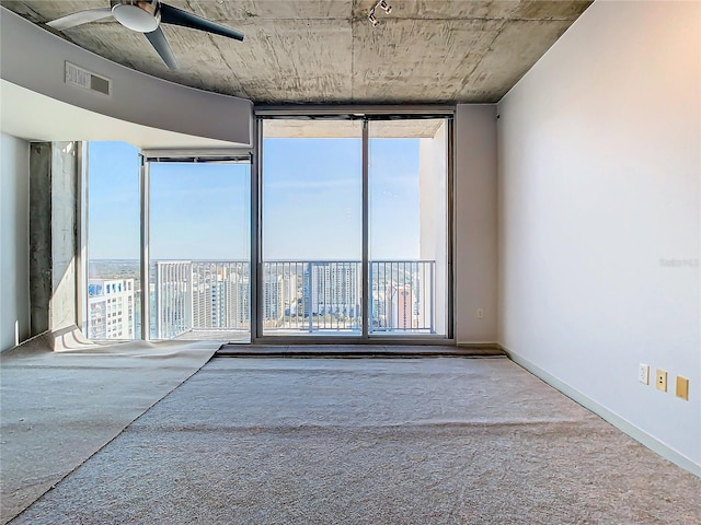 carpeted empty room with ceiling fan