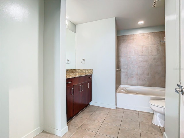 full bathroom featuring tiled shower / bath combo, vanity, tile patterned floors, and toilet