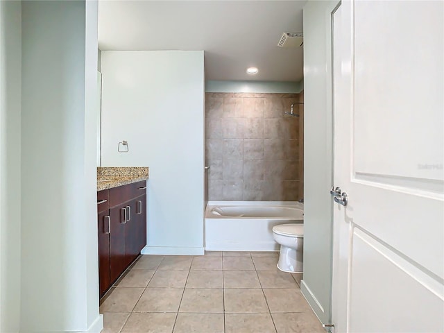 full bathroom featuring vanity, tiled shower / bath combo, tile patterned floors, and toilet