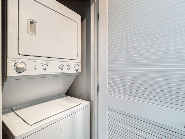 laundry area with stacked washer and dryer