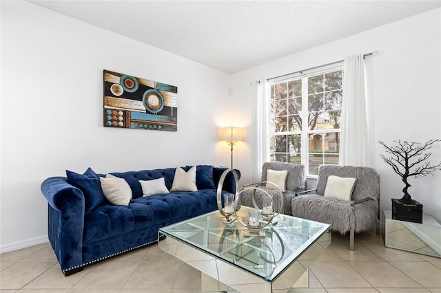 living room with light tile patterned floors and a textured ceiling