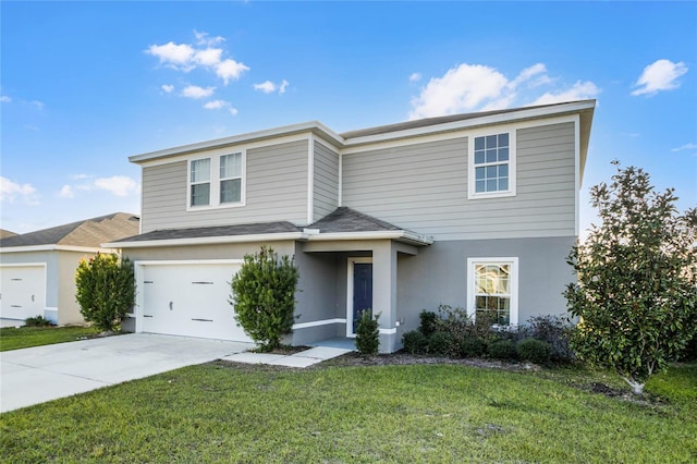 front facade with a garage and a front lawn