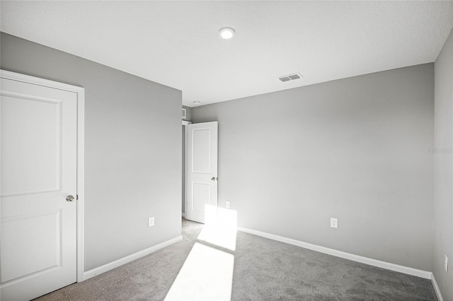 unfurnished bedroom with light colored carpet