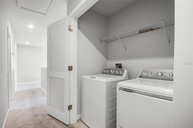 washroom featuring light colored carpet and washer and clothes dryer