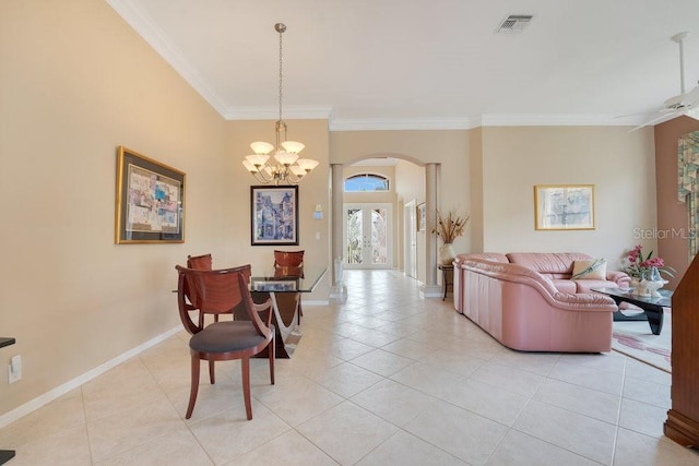 dining room with light tile patterned flooring, ornamental molding, ceiling fan with notable chandelier, and french doors