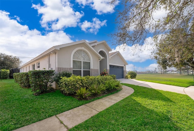 view of front facade with a garage and a front yard