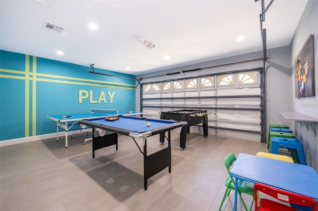 playroom with light wood-type flooring