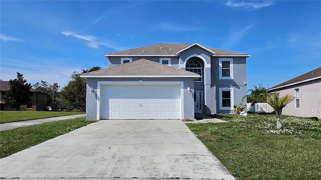 view of property with a garage and a front yard