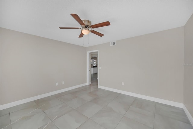 unfurnished room with ceiling fan