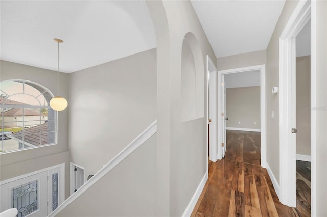 hall with dark hardwood / wood-style flooring